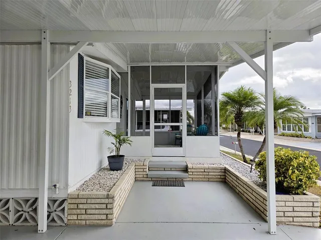 a living room with furniture a stove and a wooden floor