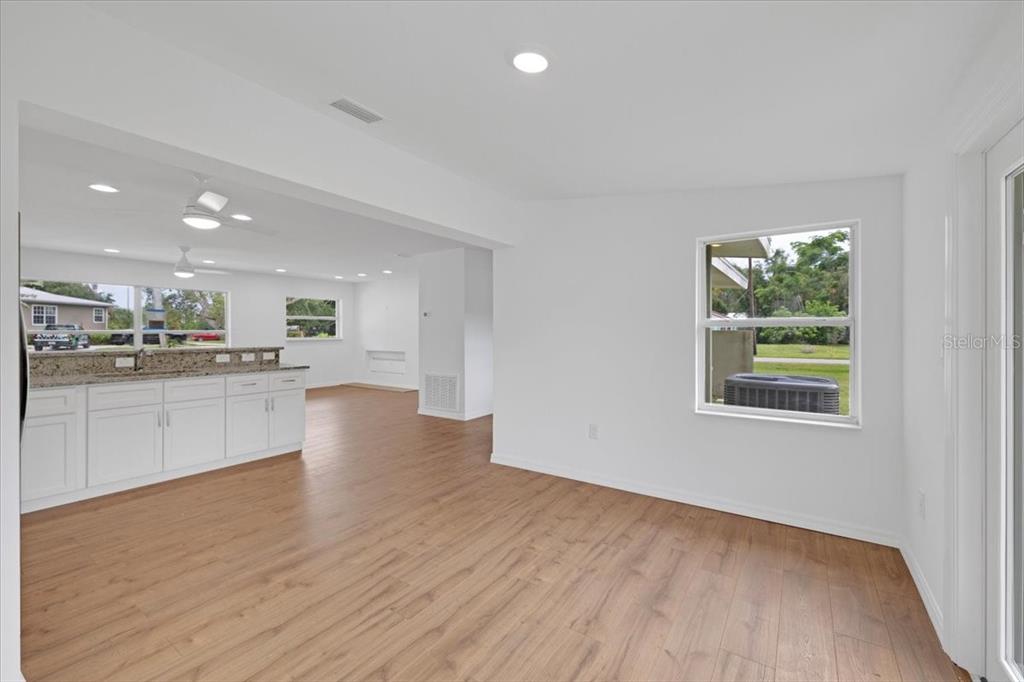 2206 Mark Avenue Punta Gorda, FL 33950 - Photo 11 of 22 a view of kitchen with wooden floor electronic appliances and window