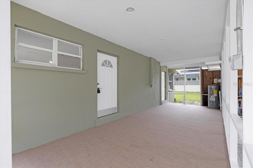 2206 Mark Avenue Punta Gorda, FL 33950 - Photo 3 of 22 a view of an empty room with a window
