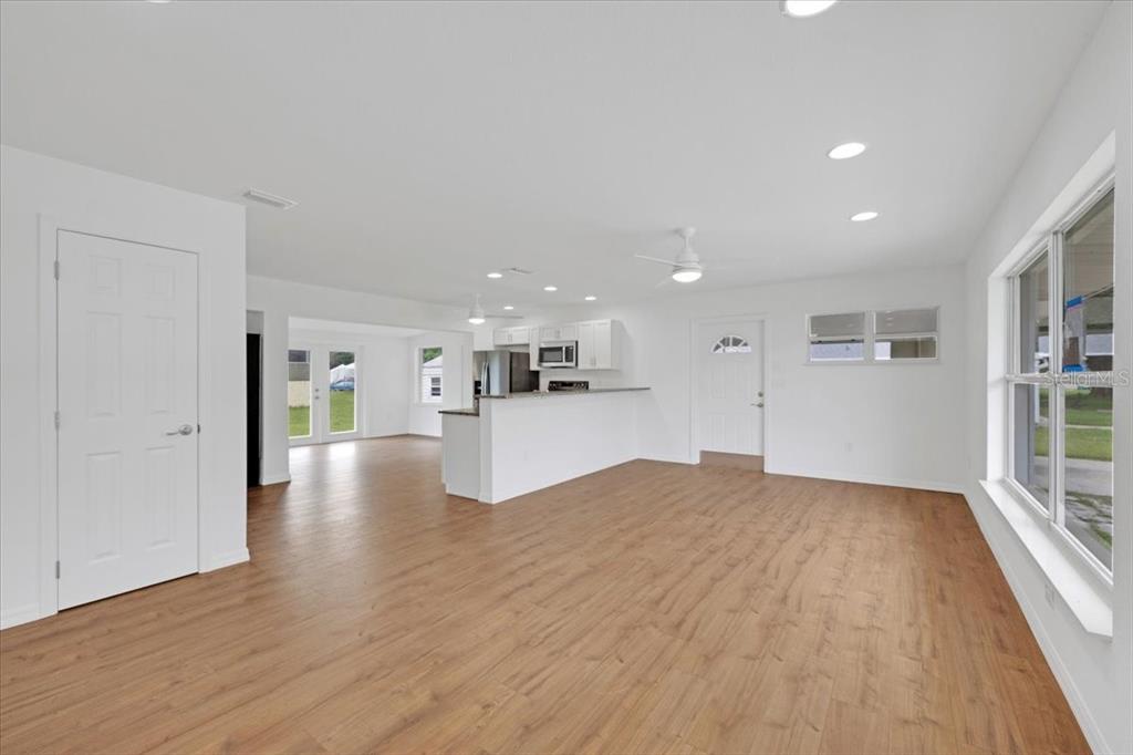 2206 Mark Avenue Punta Gorda, FL 33950 - Photo 6 of 22 a view of a kitchen with wooden floor and a kitchen