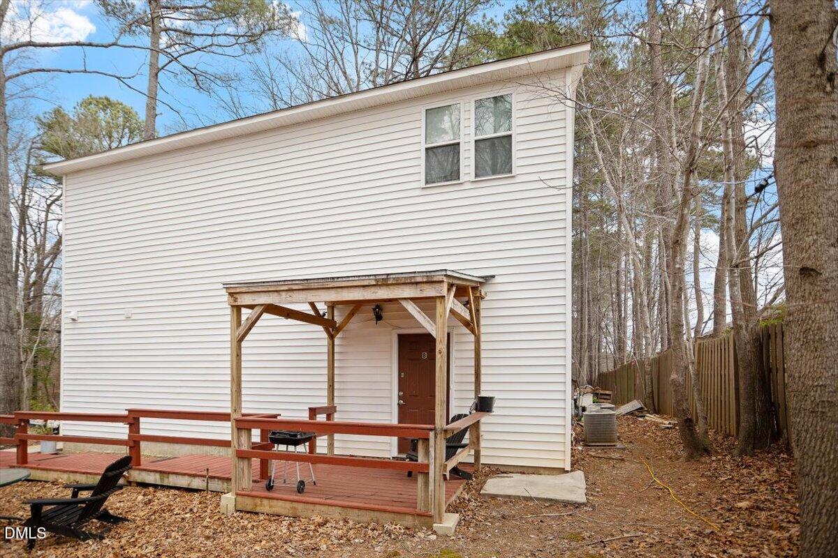 5501 Bobbitt Road Apex, NC 27539 - Photo 4 of 36 Side door on right that leads to upper level of home.