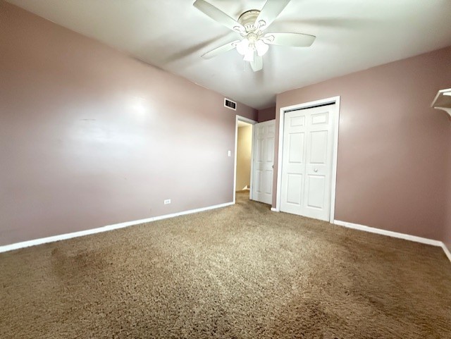 969 Dearborn Circle Carol Stream, IL 60188 - Photo 17 of 46 an empty room with a chandelier fan and windows