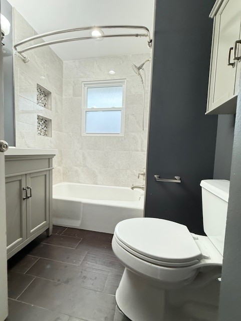 969 Dearborn Circle Carol Stream, IL 60188 - Photo 20 of 46 a white toilet sitting next to a bathroom sink and tub