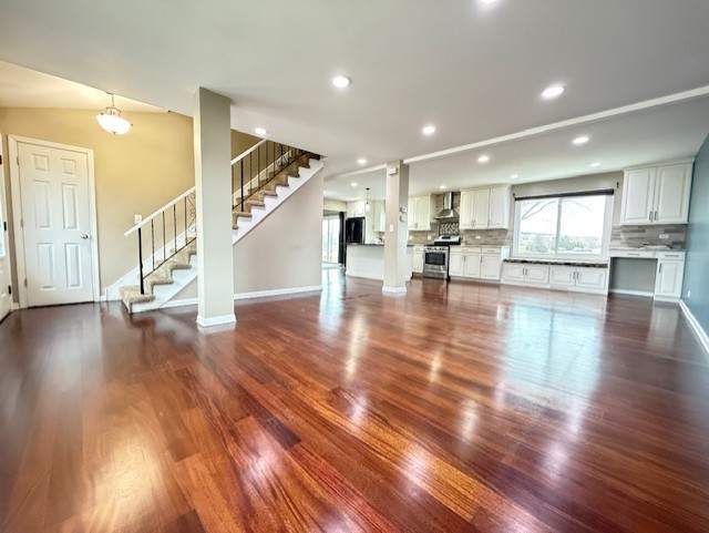 969 Dearborn Circle Carol Stream, IL 60188 - Photo 4 of 46 a view of a kitchen with furniture and wooden floor