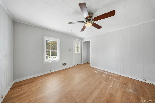 a view of an empty room with a window