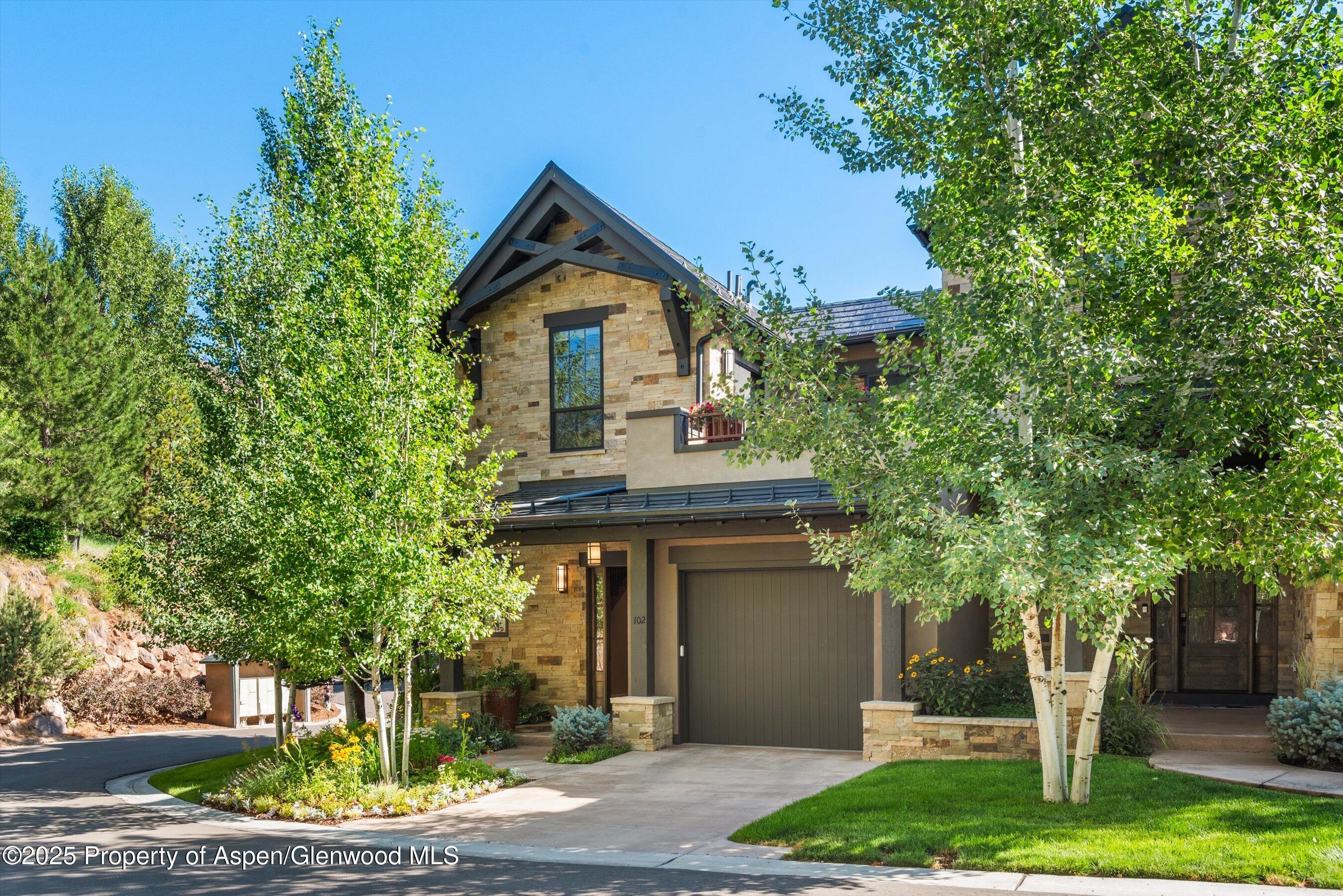 102 Wild Spring Lane Basalt, CO 81621 - Photo 2 of 51 a front view of a house with a garden