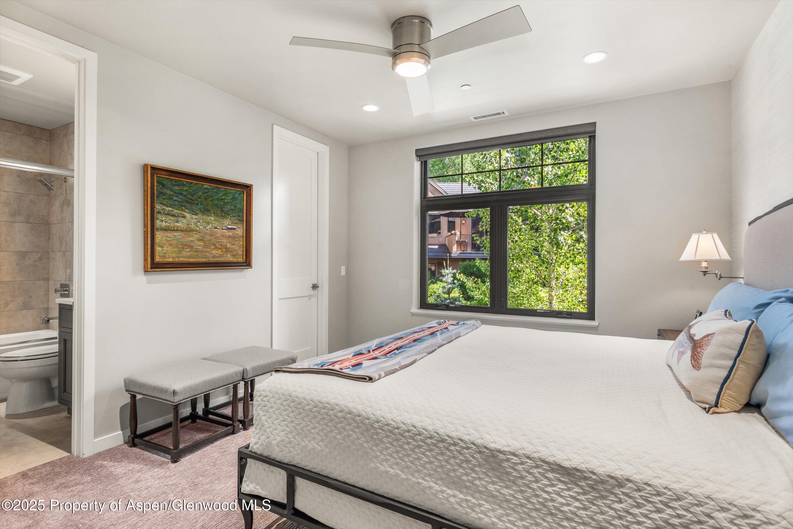 102 Wild Spring Lane Basalt, CO 81621 - Photo 34 of 51 a bedroom with a bed and a window