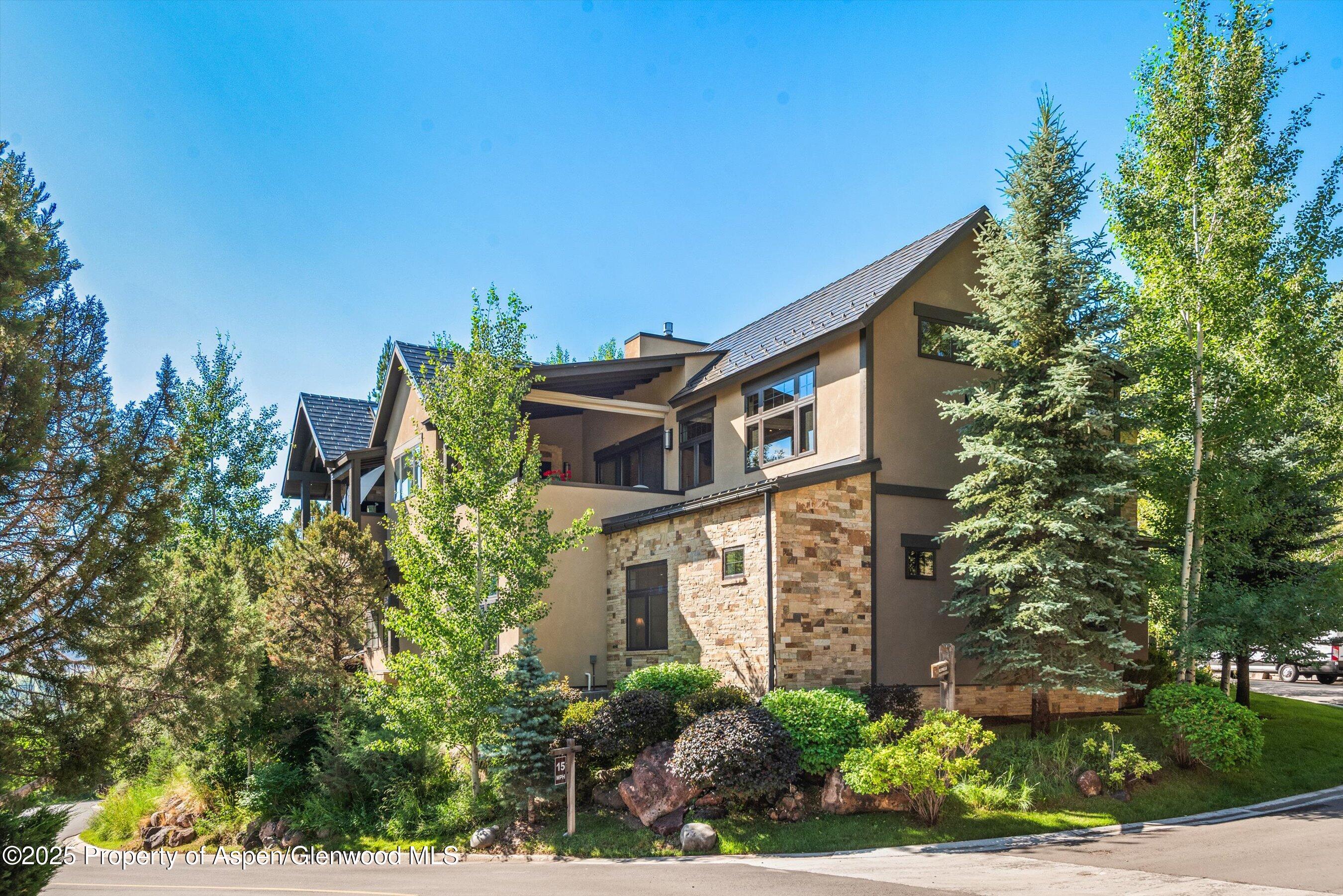 102 Wild Spring Lane Basalt, CO 81621 - Photo 46 of 51 a yellow building with trees in front of it