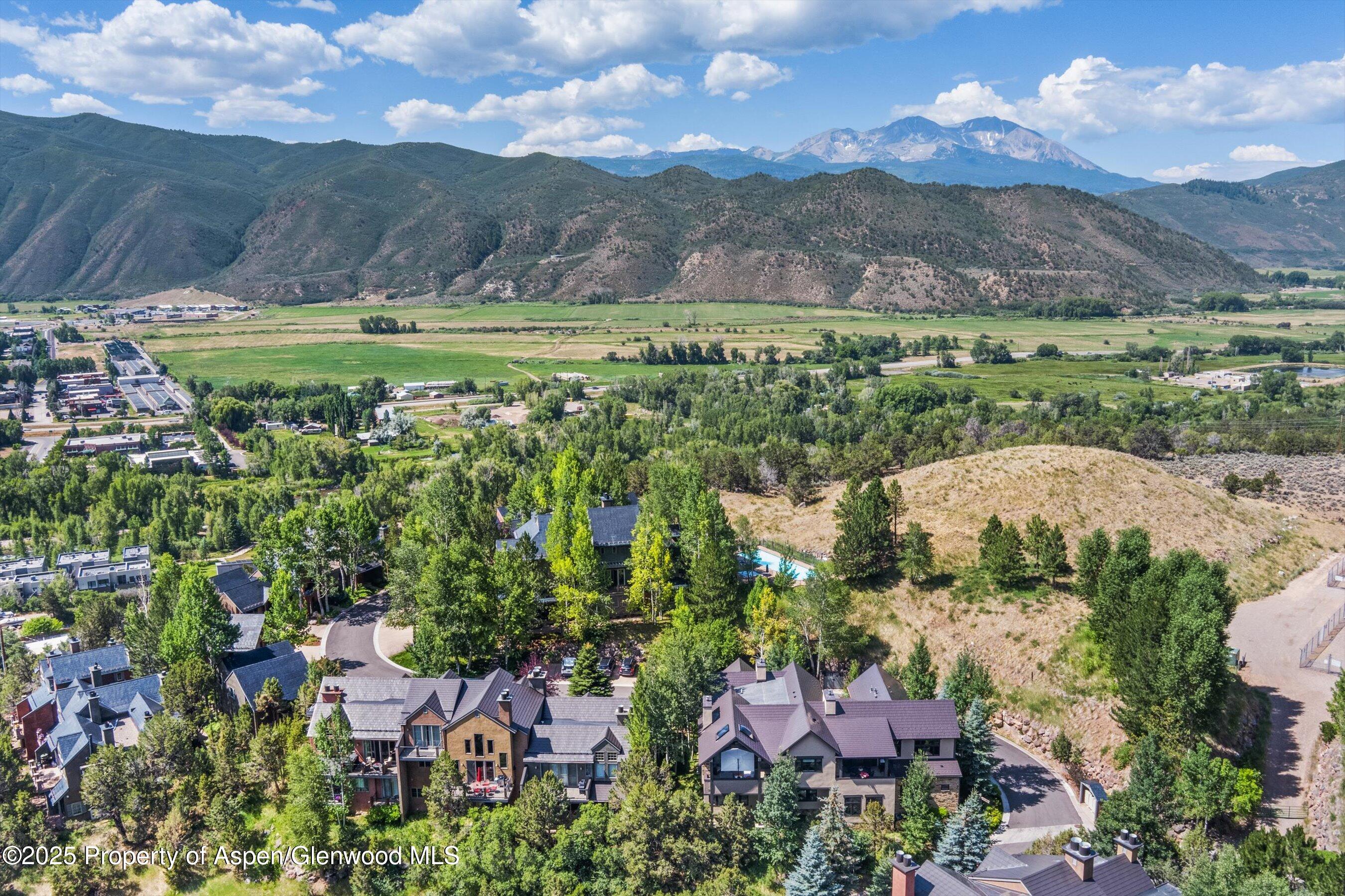 102 Wild Spring Lane Basalt, CO 81621 - Photo 49 of 51 a view of a city with mountains in the background