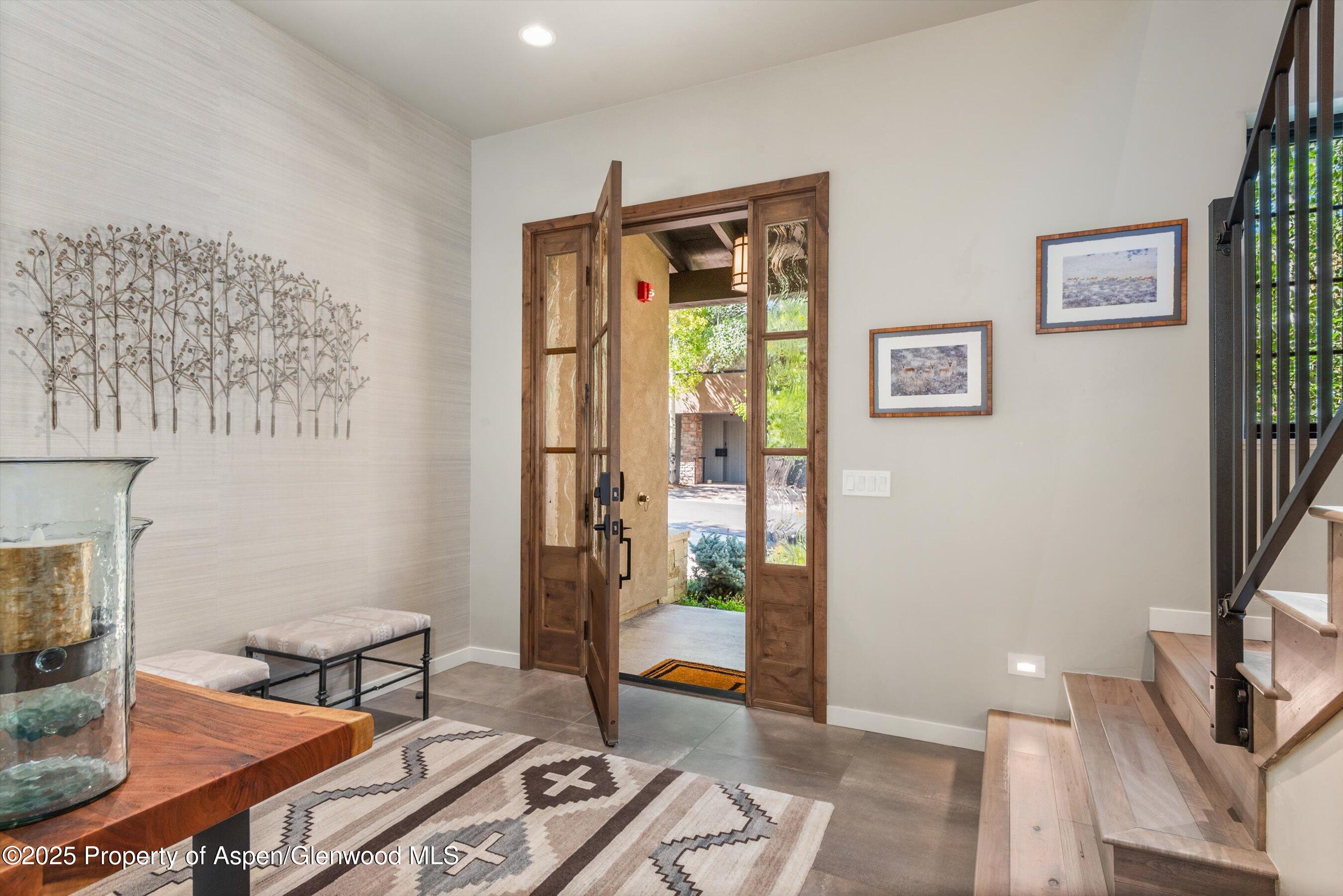 102 Wild Spring Lane Basalt, CO 81621 - Photo 5 of 51 a living room with furniture and a fireplace