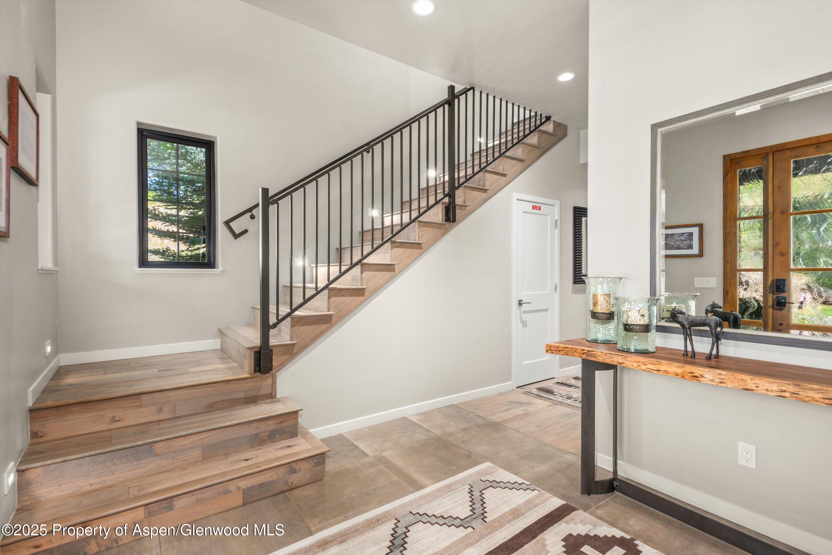 102 Wild Spring Lane Basalt, CO 81621 - Photo 6 of 51 a view of entryway and hall with wooden floor