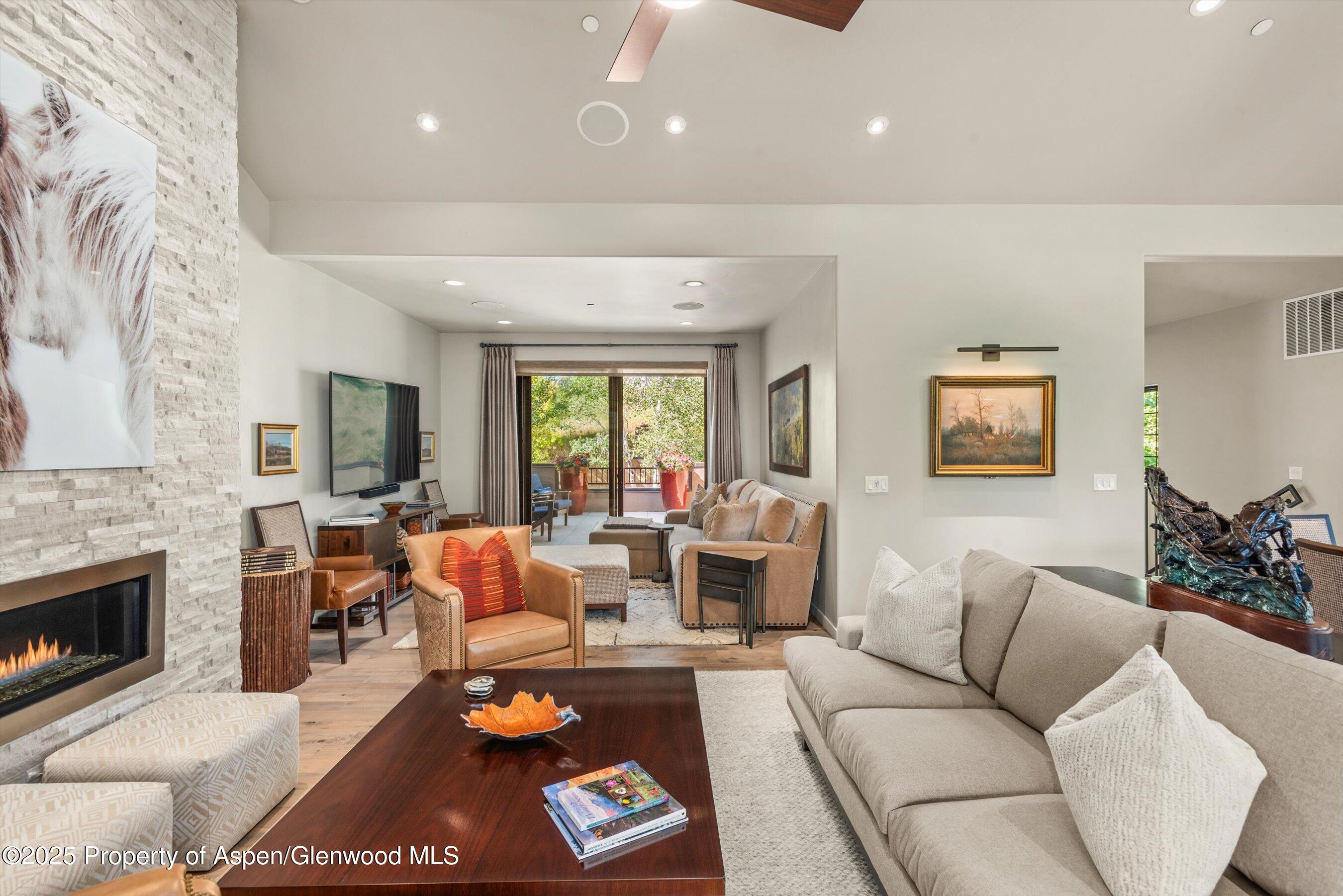 102 Wild Spring Lane Basalt, CO 81621 - Photo 9 of 51 a living room with furniture fireplace and flat screen tv
