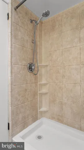 a bathroom with a shower and a bathtub