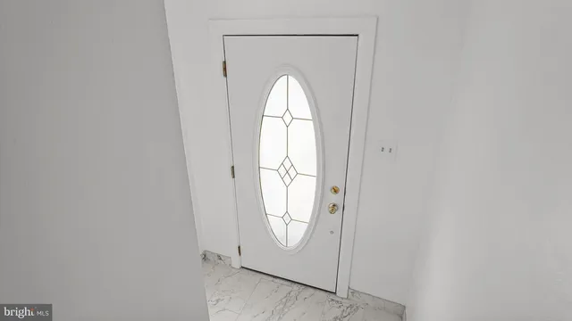 with view of a livingroom with a bathroom and a window