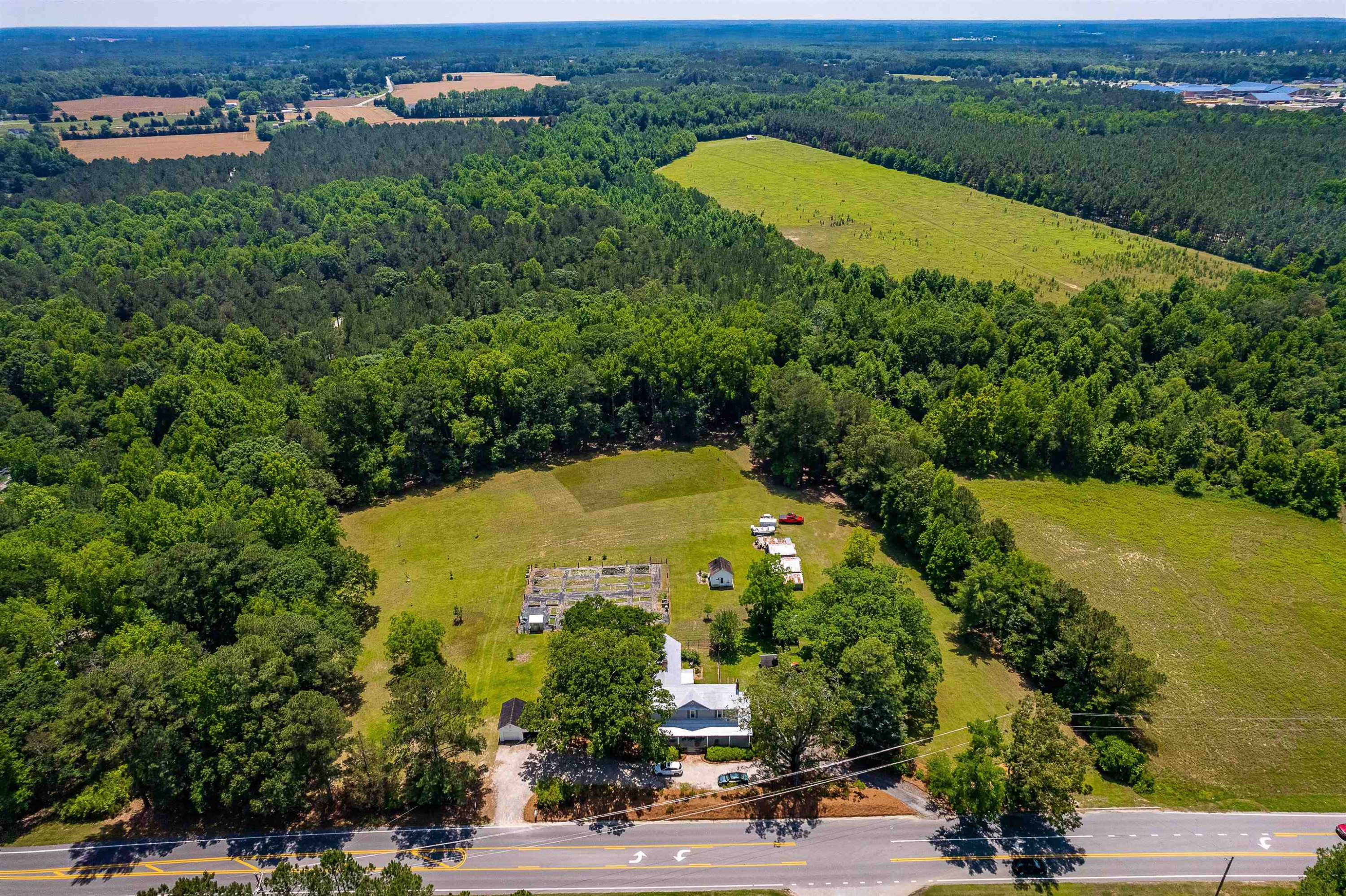 6467 Cleveland Road Clayton, NC 27520 - Photo 2 of 54 Surrounded by a nursery and a 70 acre homesteader privacy abounds. Large 1.75 Acre Lot