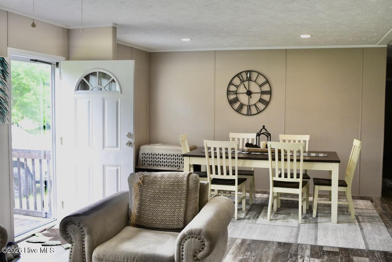 1430 Nixonton Road Elizabeth City, NC 27909 - Photo 11 of 30 The formal dining room is quite large enough. This is a 6 person table and there is room to spare.