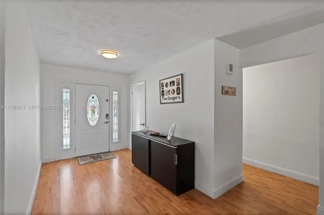 a view of a livingroom with furniture and a wooden floor