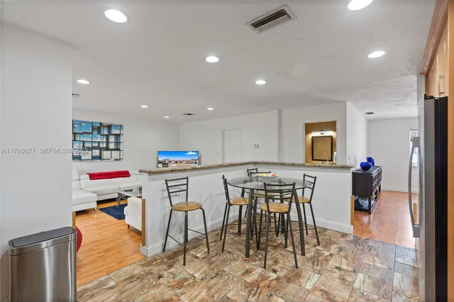 a bedroom with furniture and a flat screen tv