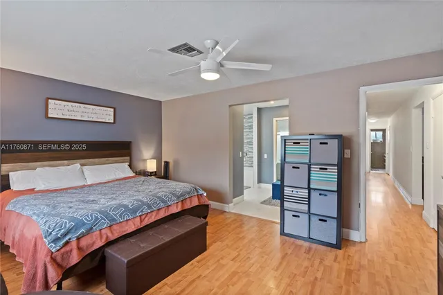 a bedroom with a bed couch and window