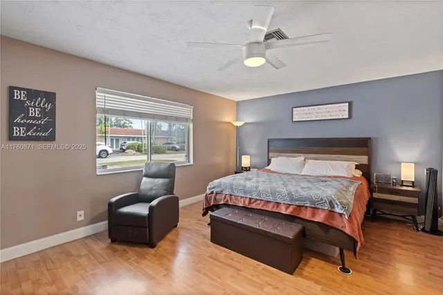 a bathroom with a sink toilet vanity and shower