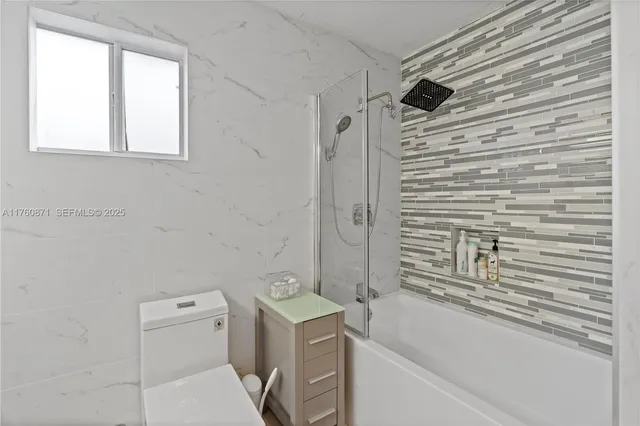 a bedroom with bed and furniture