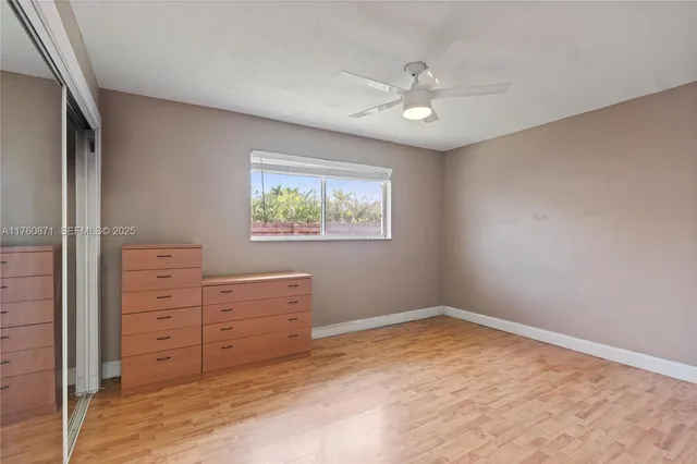a view of a house with swimming pool and a yard