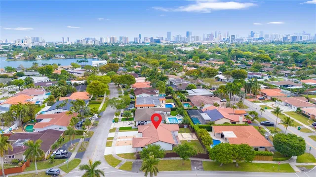 an aerial view of residential houses with outdoor space