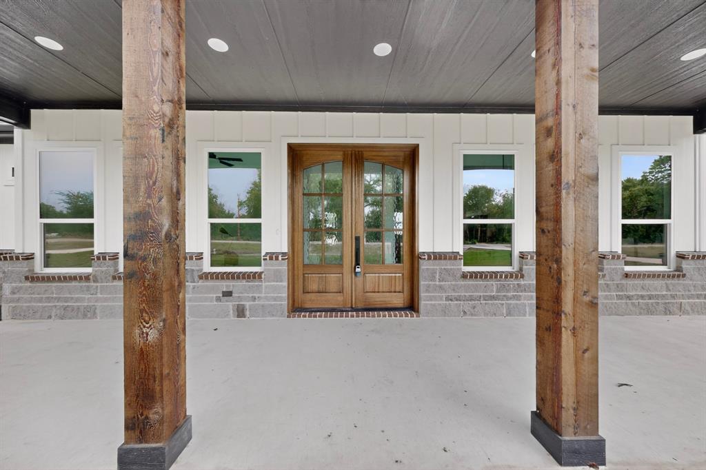 9080 County Road 669 Blue Ridge, TX 75424 - Photo 6 of 40 a view of an entryway with a floor to ceiling window