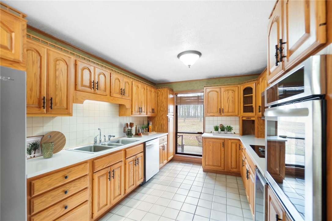 14333 Meranda Road Anna, OH 45302 - Photo 27 of 98 This spacious kitchen offers ample storage and modern appliances for culinary pursuits.
