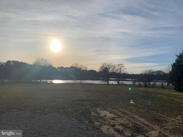 a view of lake with mountain in the background