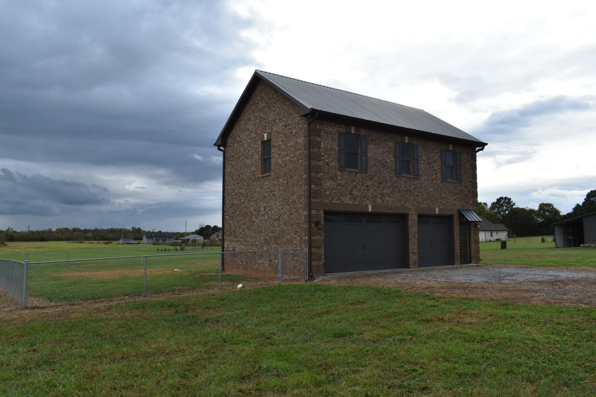 232 Sudberry Road Bell Buckle, TN 37020 - Photo 1 of 10 a front view of a house with a garden