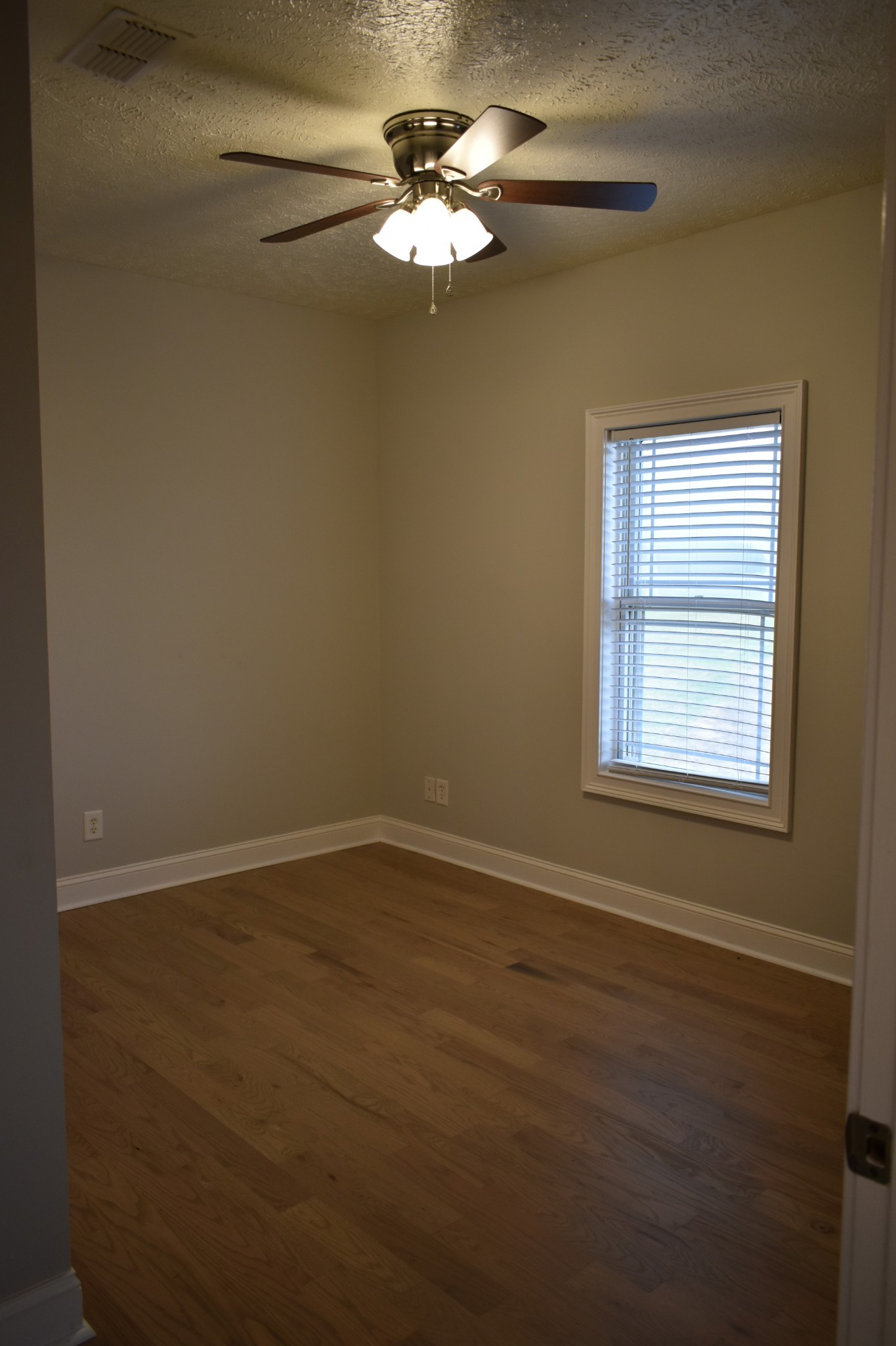 232 Sudberry Road Bell Buckle, TN 37020 - Photo 6 of 10 a view of an empty room with a window
