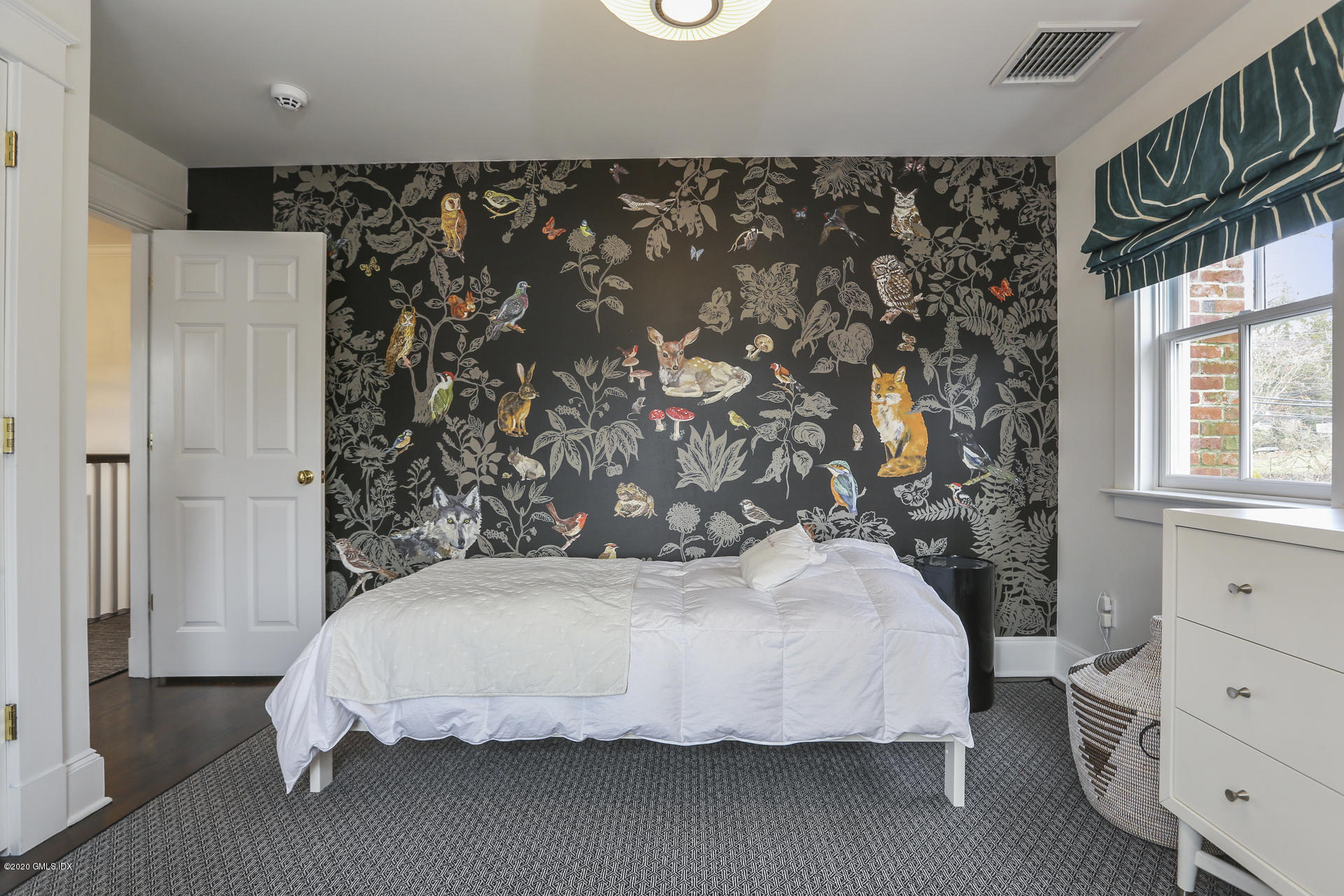 2 William Street Riverside, CT 06878 - Photo 17 of 28 a bed sitting in a bedroom next to a window