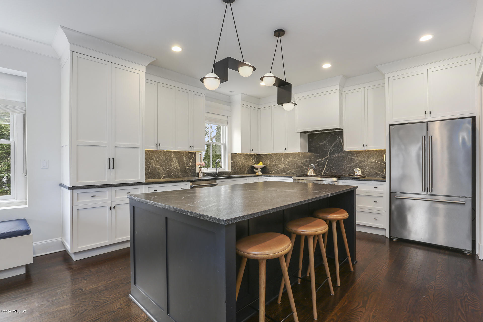 2 William Street Riverside, CT 06878 - Photo 8 of 28 a kitchen with stainless steel appliances granite countertop a sink a stove a refrigerator and island with wooden floor