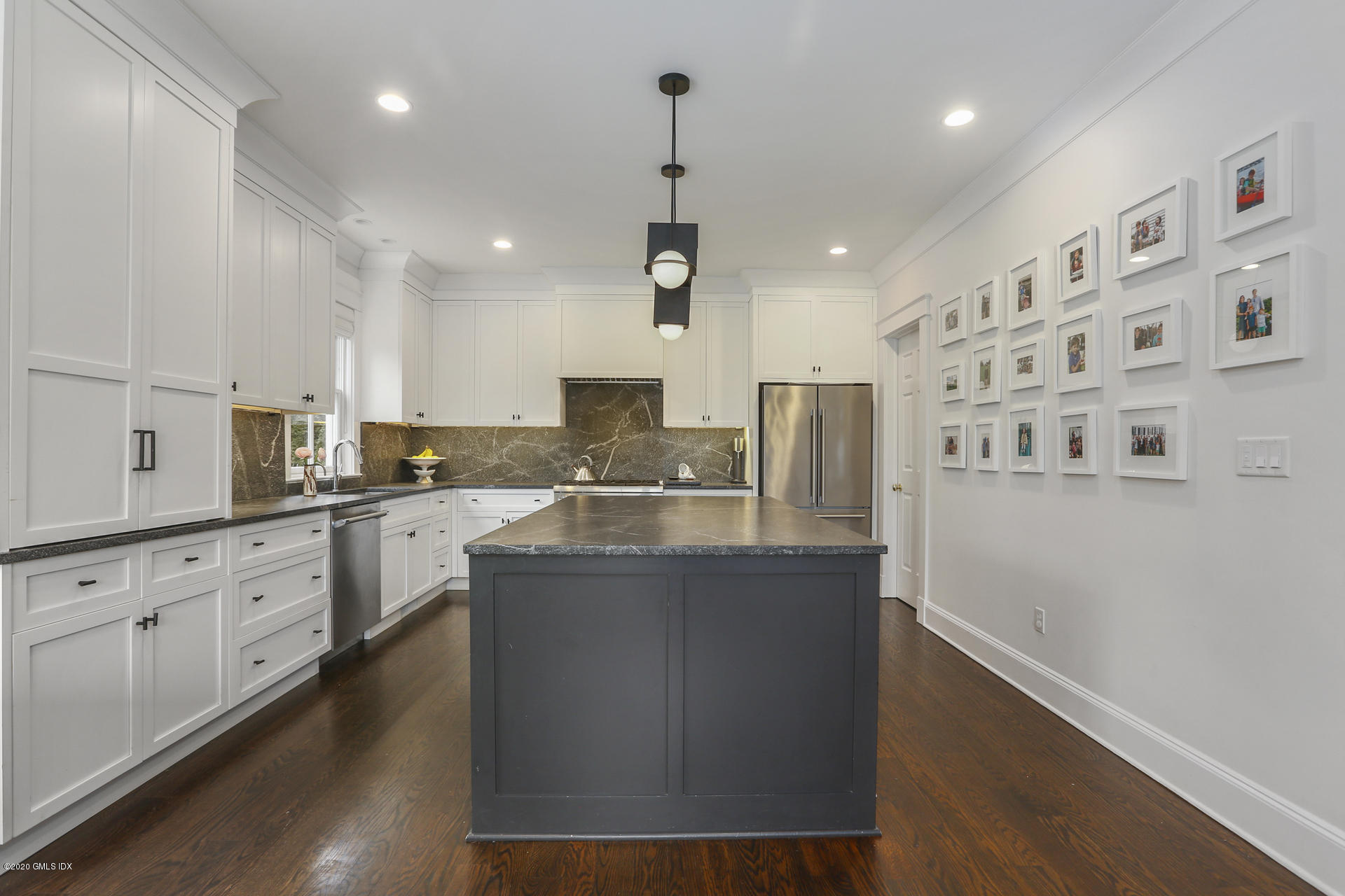 2 William Street Riverside, CT 06878 - Photo 9 of 28 a kitchen with stainless steel appliances granite countertop a sink a stove and a refrigerator