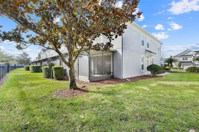 a backyard of a house with lots of green space
