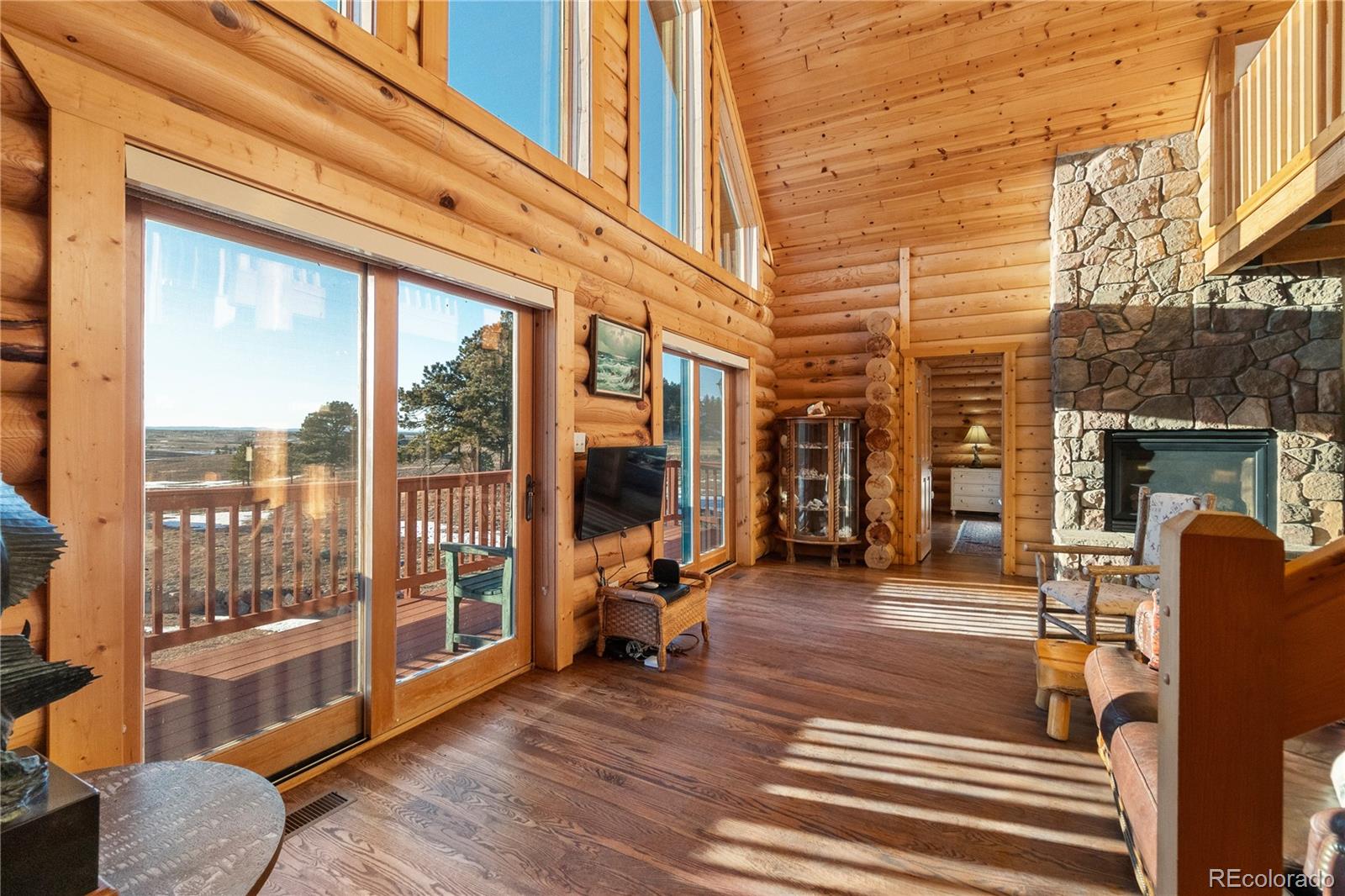 17245 Elbert Road Peyton, CO 80831 - Photo 12 of 45 a view of a living room and balcony with furniture