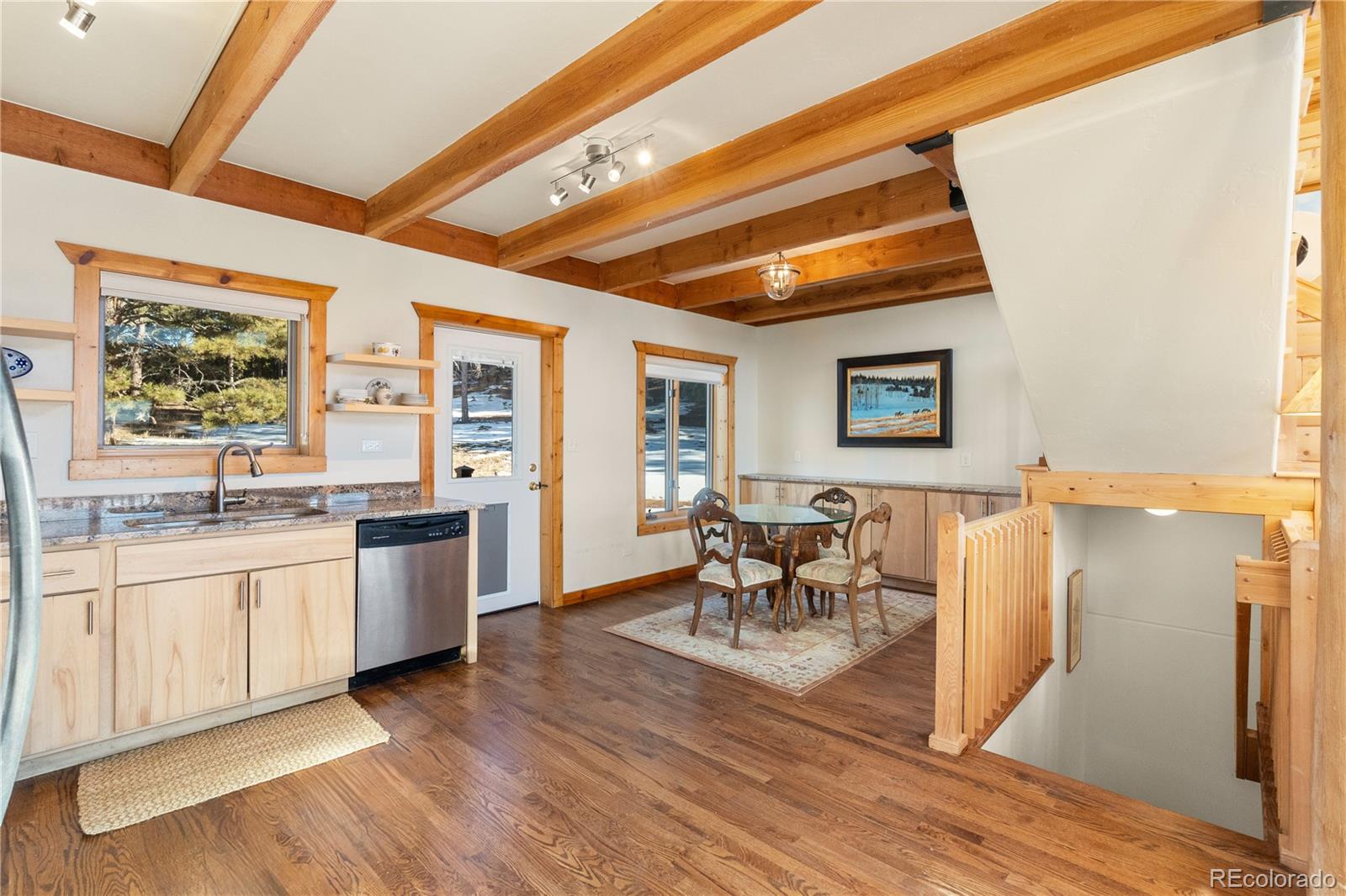 17245 Elbert Road Peyton, CO 80831 - Photo 15 of 45 a dining hall with stainless steel appliances granite countertop a stove and a refrigerator