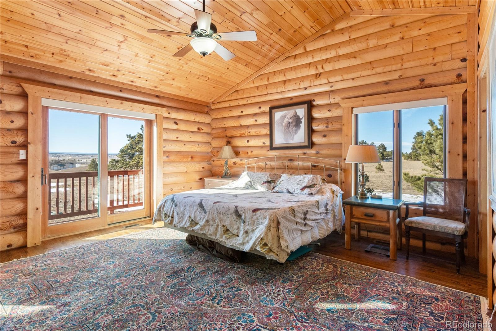 17245 Elbert Road Peyton, CO 80831 - Photo 17 of 45 a bedroom with a bed and a couch