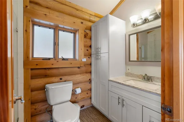 a bed room with a bed and wooden floor