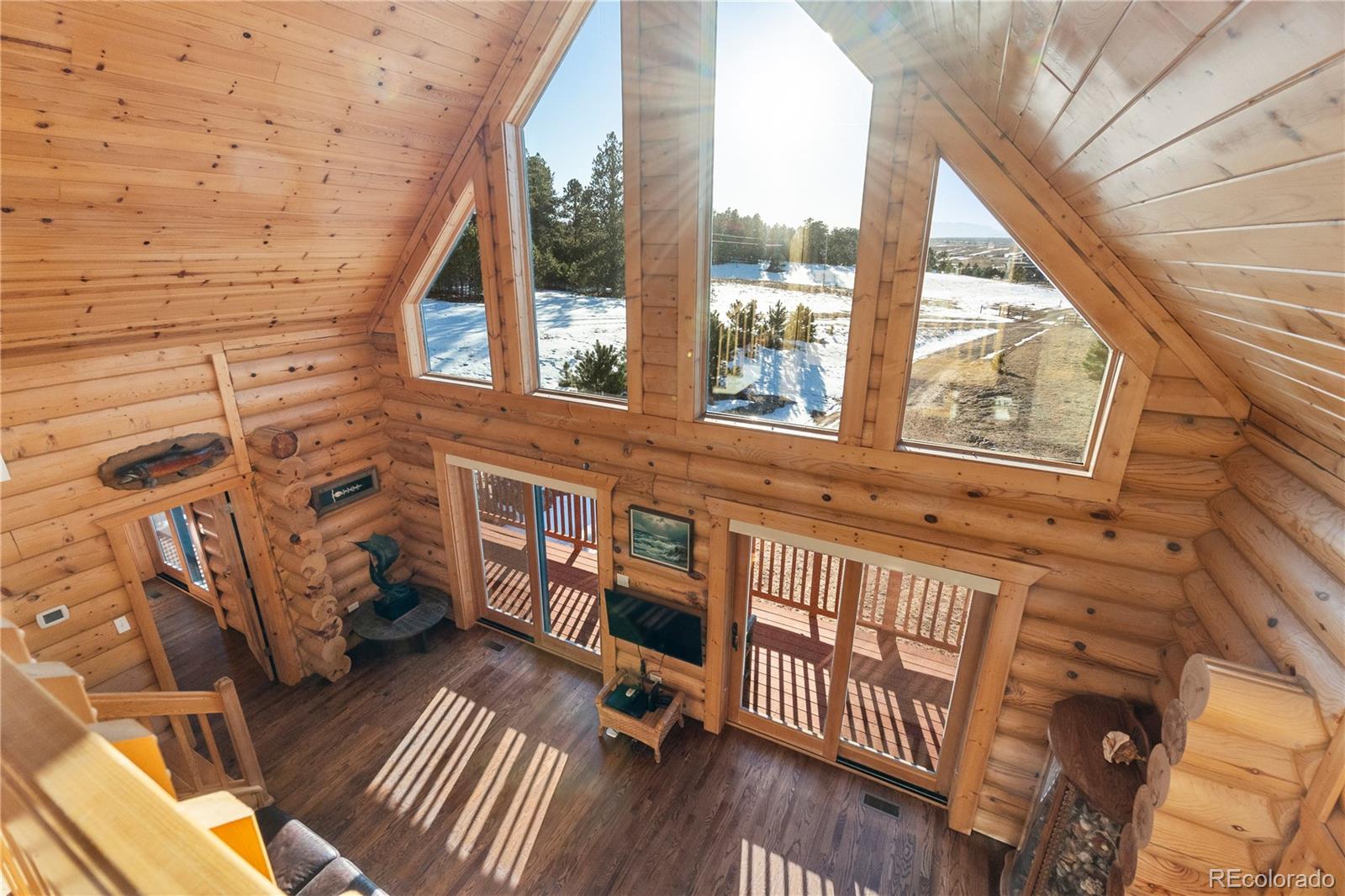 17245 Elbert Road Peyton, CO 80831 - Photo 26 of 45 a view of a brick house with a large window