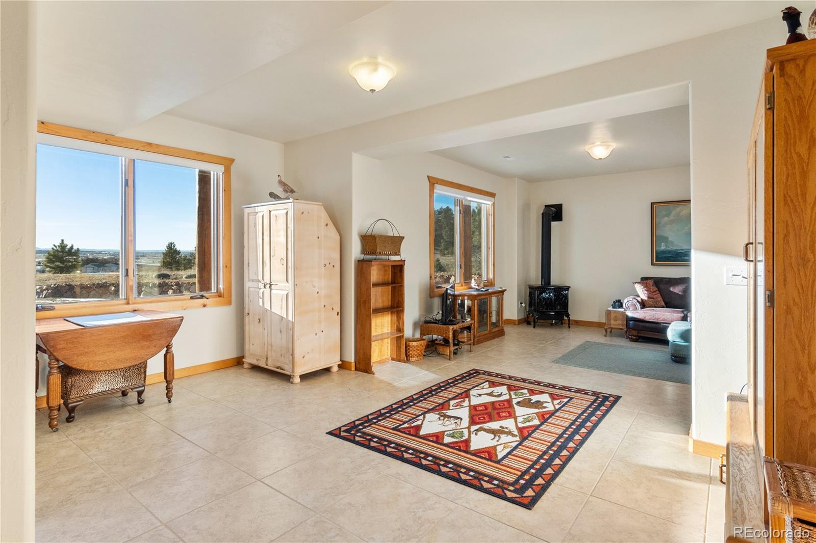 17245 Elbert Road Peyton, CO 80831 - Photo 28 of 45 a living room with furniture and a large window