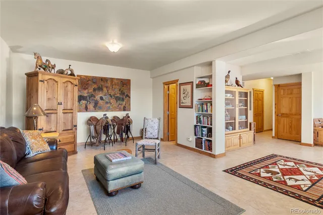 a bathroom with a granite countertop sink mirror vanity and toilet