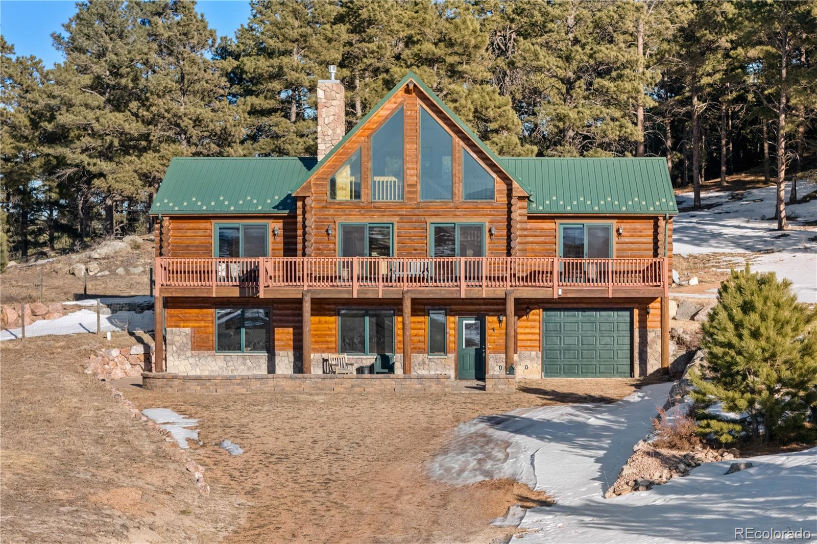17245 Elbert Road Peyton, CO 80831 - Photo 3 of 45 front view of a house with a street