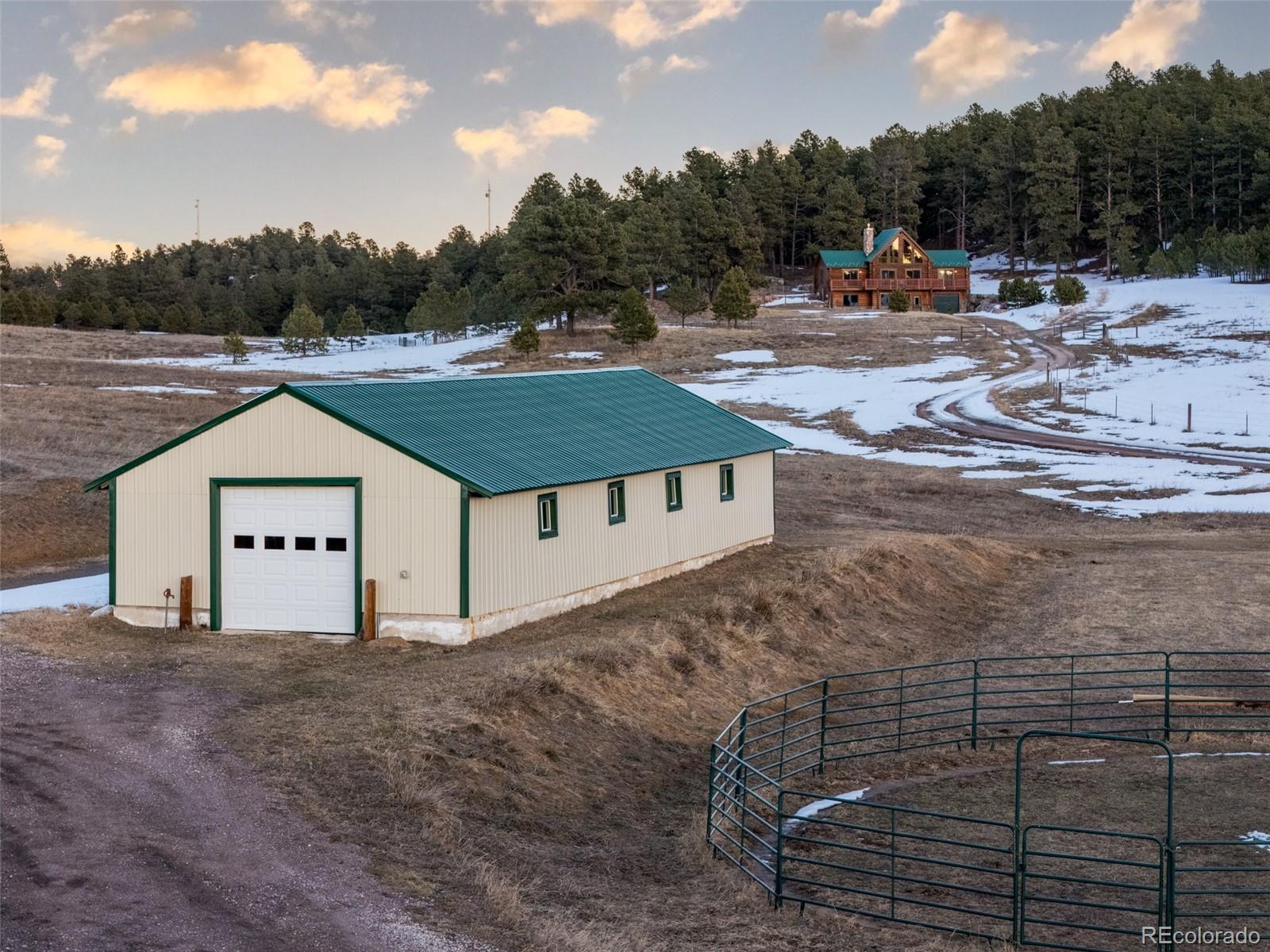 17245 Elbert Road Peyton, CO 80831 - Photo 32 of 45 a view of a white house with a yard