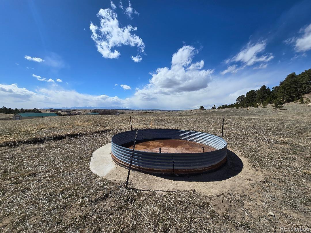17245 Elbert Road Peyton, CO 80831 - Photo 37 of 45 a view of a swimming pool with a yard