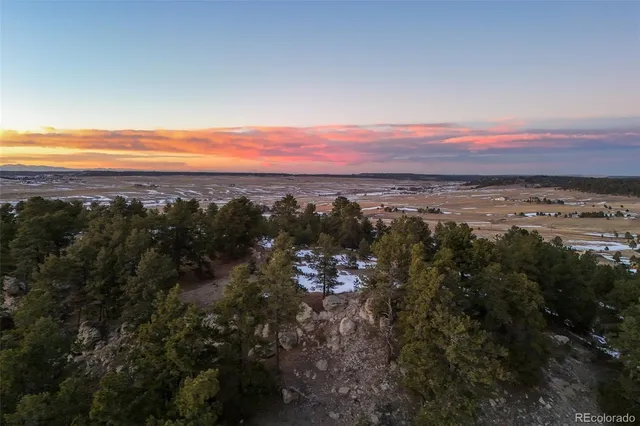a view of a swimming pool and a yard