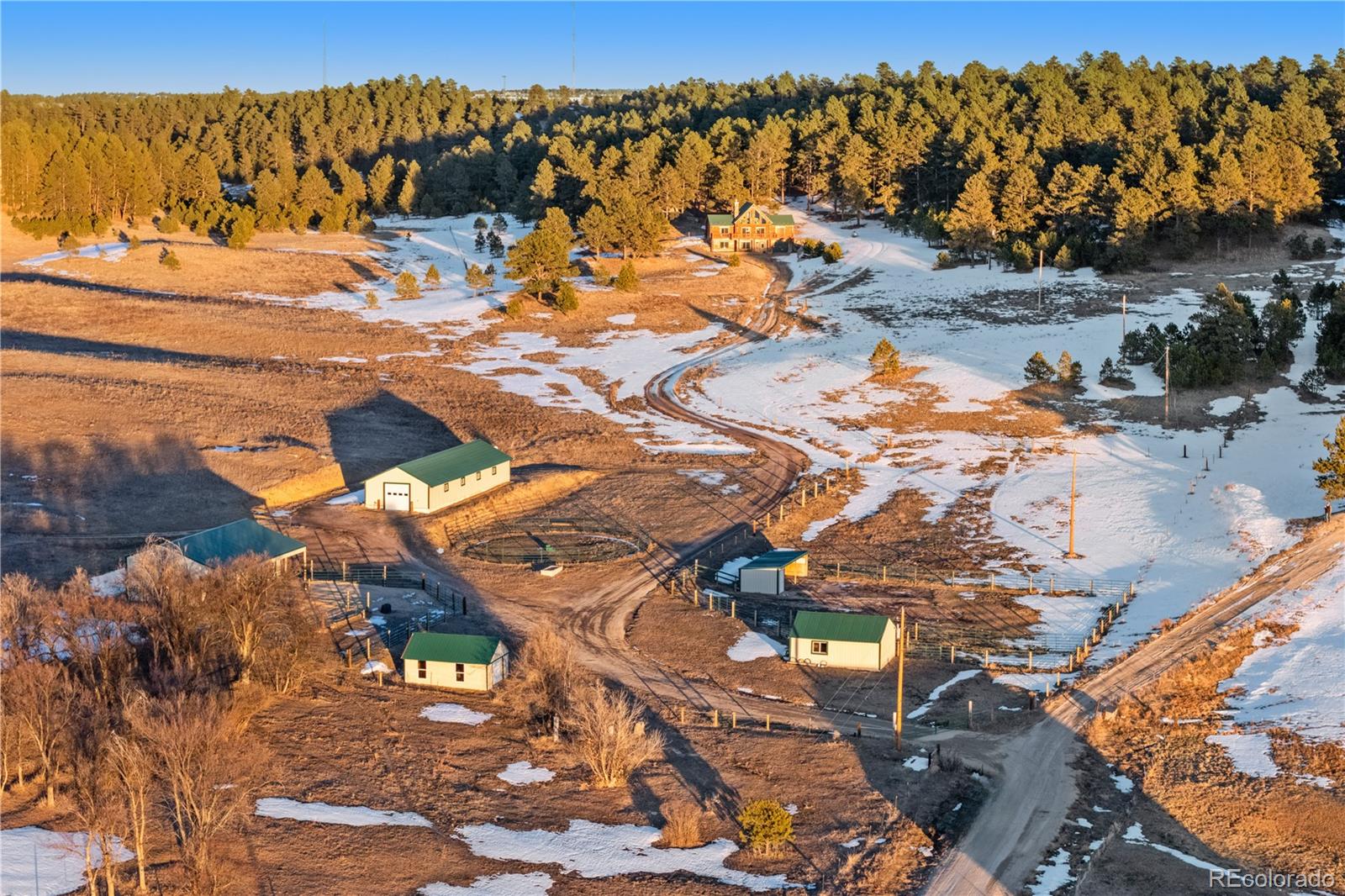 17245 Elbert Road Peyton, CO 80831 - Photo 6 of 45 a view of a yard with wooden fence