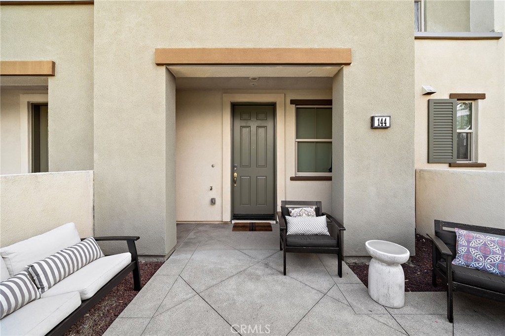 144 Paramount Irvine, CA 92618 - Photo 24 of 43 a living room with furniture and wooden floor