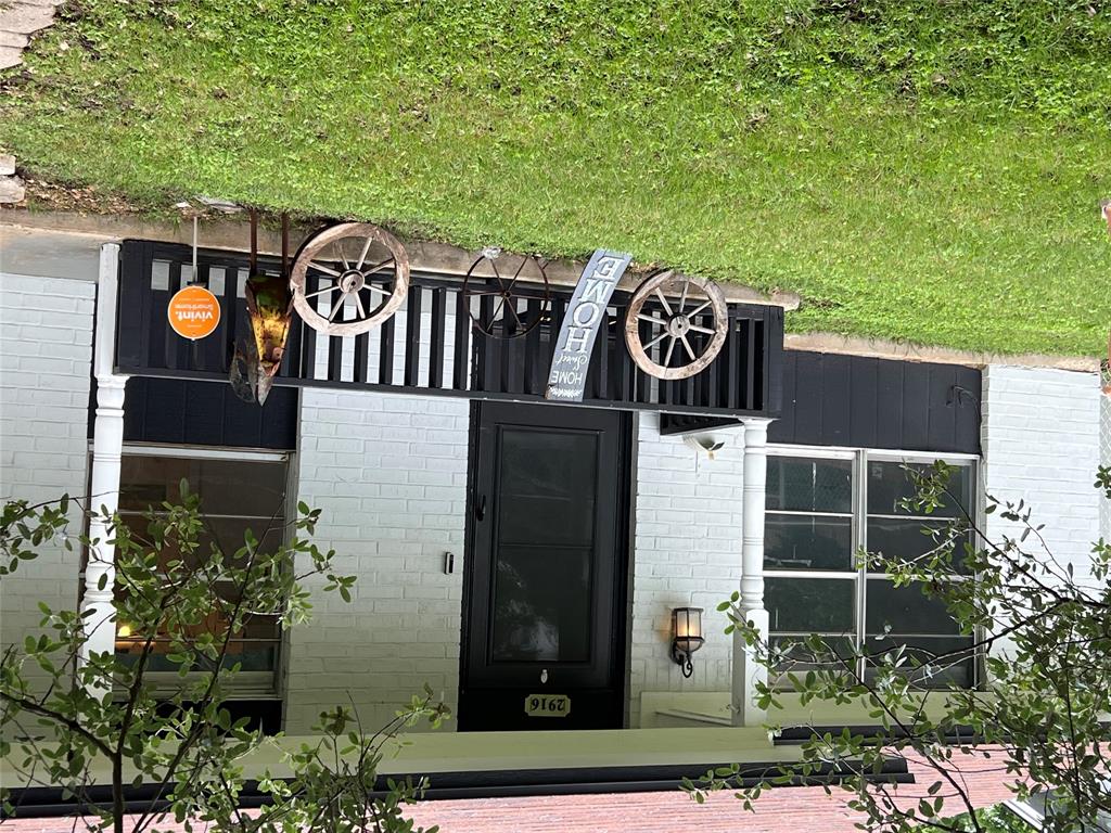 an front view of a house with garden